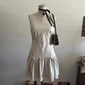 Cream drop waist ruffle dress with ribbons